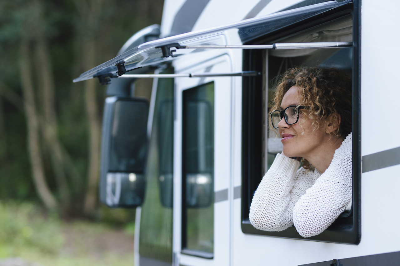 RV owner looking out of RV window before putting RV into RV storage in Utah