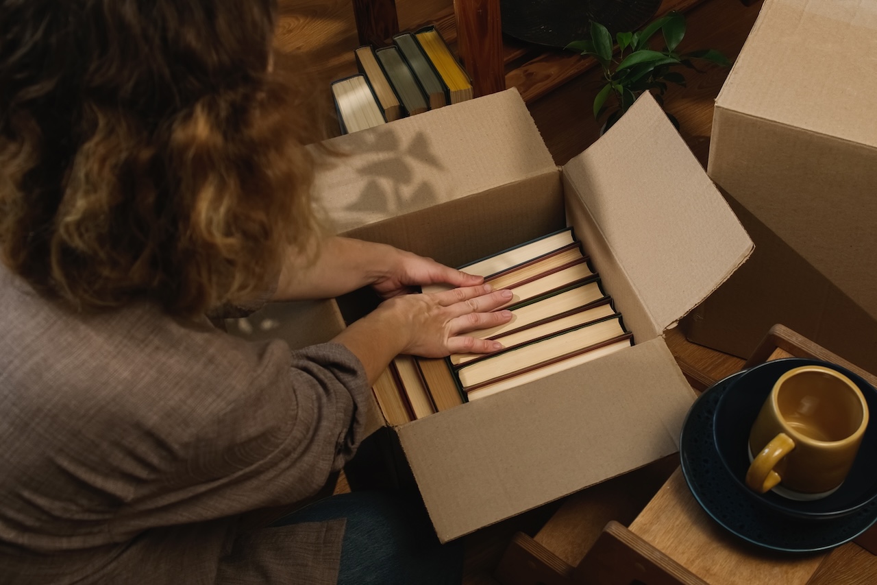 woman packing boxes for climate controlled storage units