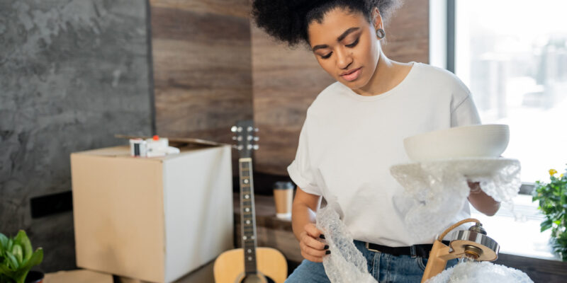 Woman packing items into boxes